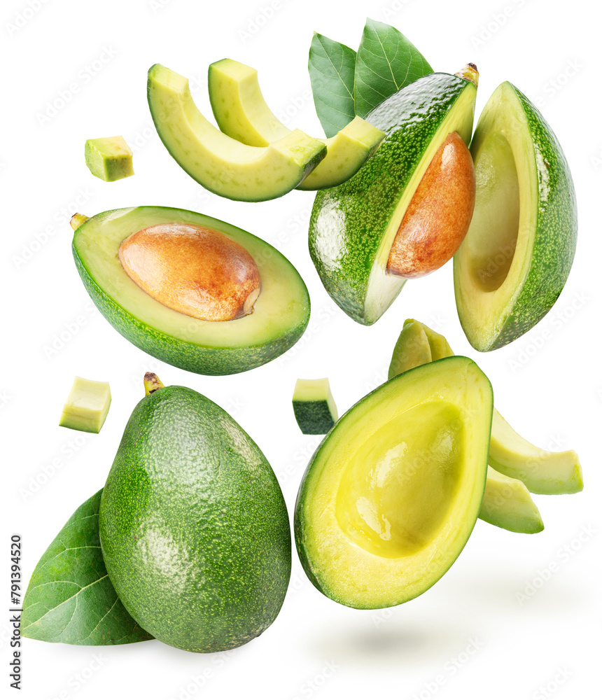 Avocado fruits and avocado slices levitating in air isolated on white background.