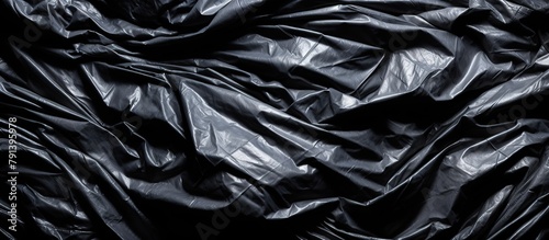 Wrinkled plastic wrap texture on a black background