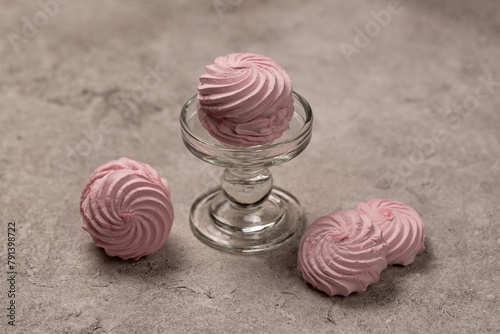 Raspberry berry marshmallows, Russian dessert, on a glass stand, open space