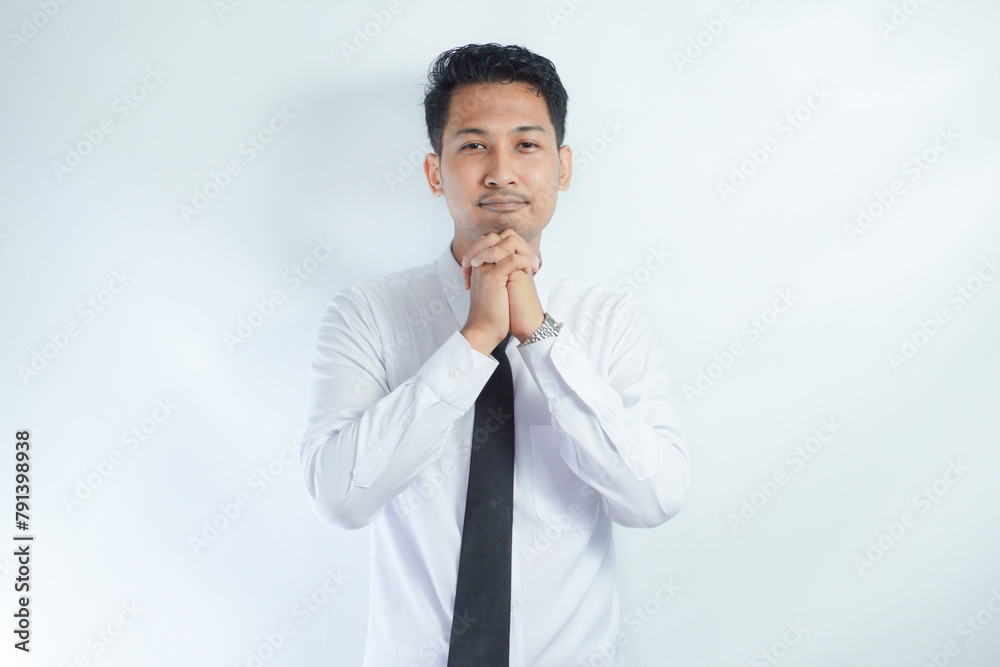 Adult Asian man relax while imagine something with happy expression Adult Asian man relax while imagine something with happy expression