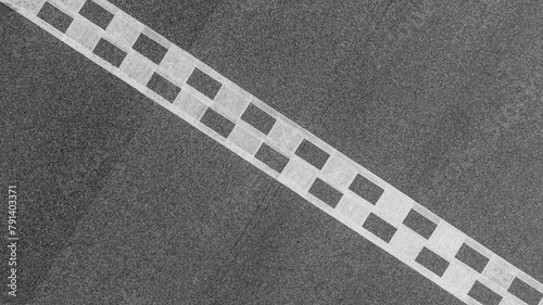 Aerial view abstract asphalt black Start and Finish grid line for race car in circuit texture background, Automobile and automotive background.