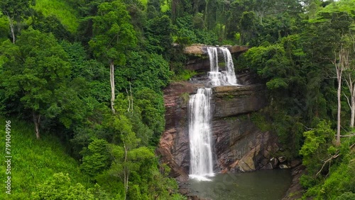 Aerial view of Thaliya Wetuna Ella Falls in green forest. Waterfall in the tropical mountain jungle. Sri Lanka. photo