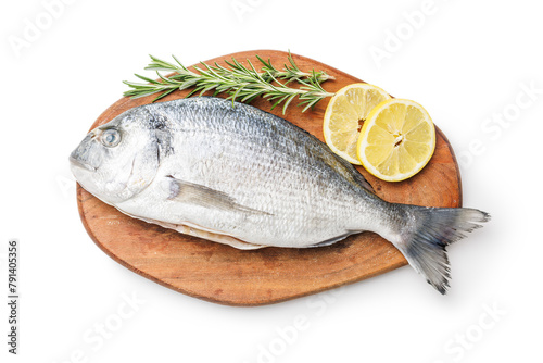 Fresh sea bream fish, rosemary and lemon on cutting board isolated on white background.