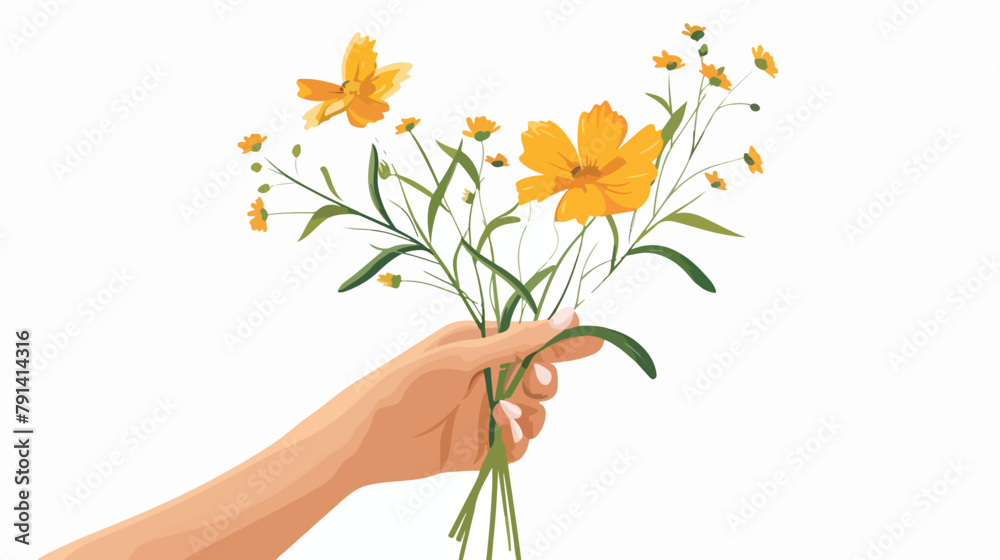 Female hand holding delicate yellow wild flower 