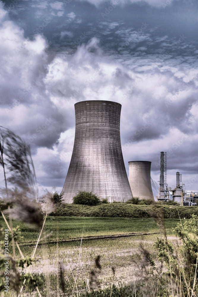 HDR Oil refinery, cooling towers and a cloudy sky. HDR Oil refinery, cooling towers and a cloudy sky.