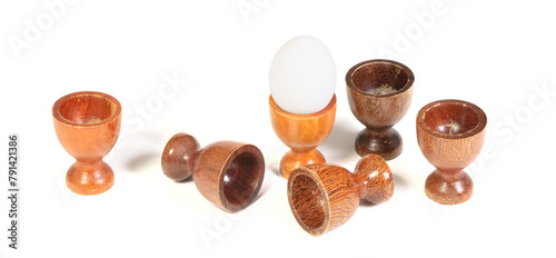Wooden eggcups isolated on white background photo