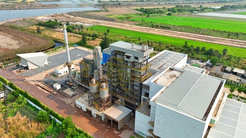 Aerial vista unveils a bustling landfill power plant, converting waste into energy. Drones capture its sprawling layout, a blend of innovation amidst environmental reclamation.
