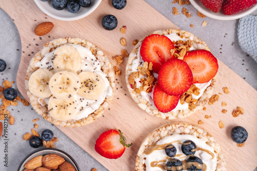Rice Crackers Healthy Snack, Crackers Topped with Banana, Fresh Berries, Yogurt and Granola, Breakfast Idea