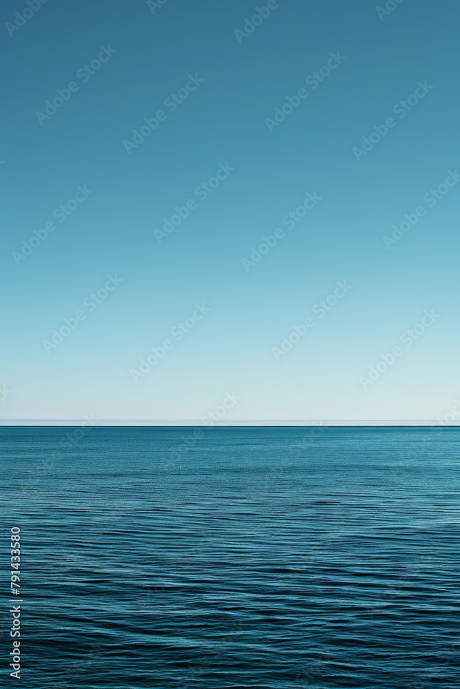 The vastness of the ocean stretching out to the horizon, with just the line where the sea meets the sky in the frame.