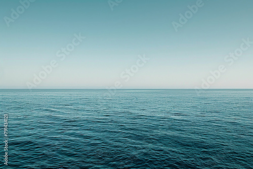 The vastness of the ocean stretching out to the horizon, with just the line where the sea meets the sky in the frame.