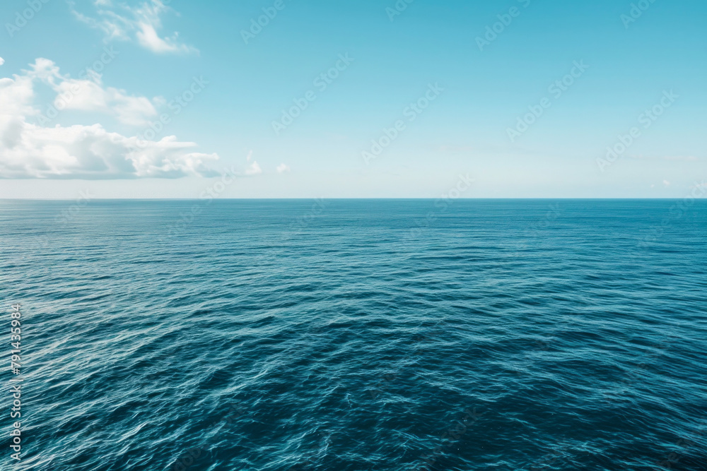 Fototapeta premium The vastness of the ocean stretching out to the horizon, with just the line where the sea meets the sky in the frame.