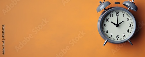 alarm clock on Silver background Minimalistic flat lay,with copy space for photo text or product, blank empty copyspace banner about time management and selfamplement concept. 