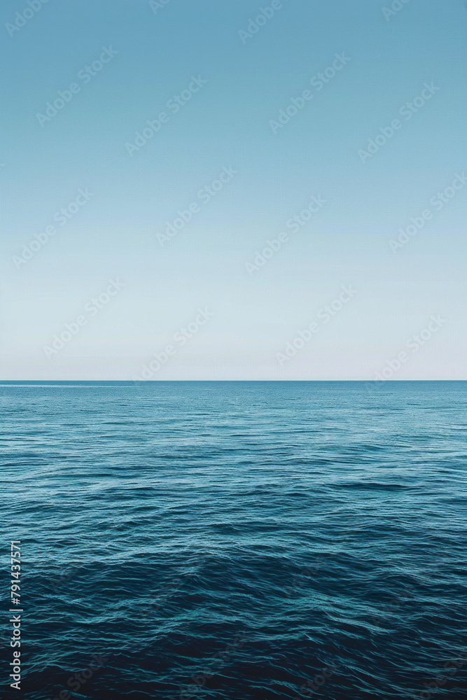 Fototapeta premium The vastness of the ocean stretching out to the horizon, with just the line where the sea meets the sky in the frame.