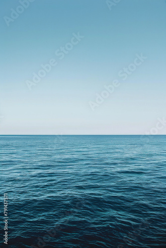 The vastness of the ocean stretching out to the horizon, with just the line where the sea meets the sky in the frame.