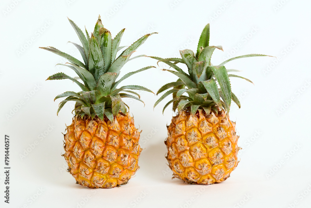 Fototapeta premium Two Pineapples Sitting Together
