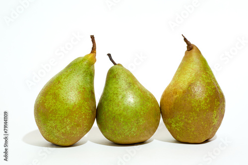 Three Pears Arranged Neatly on White Surface