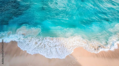 Beautiful beach with turquoise water and waves from above, top view