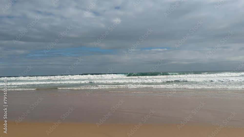sea waves lapping against an idyllic sand beach sea waves lapping against an idyllic sand beach