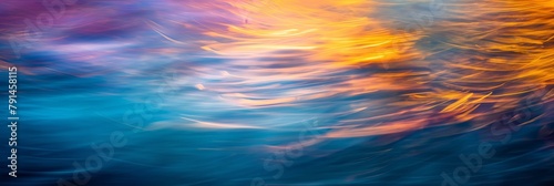Abstract play of light on water creates dynamic fire-like ripple effect in rich blue and orange hues photo
