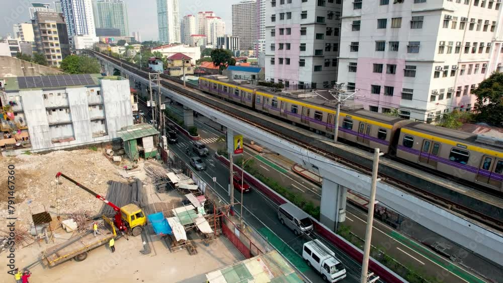 San Juan, Metro Manila, Philippines - The train of the elevated LRT-2 line passing by above Aurora Boulevard.
