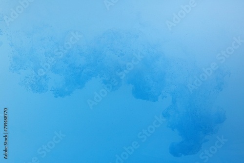 Blue color dye melt on white background,Abstract smoke pattern,Colored liquid dye,Splash pain