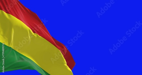 Bolivia national flag waving in the wind isolated on blue background photo