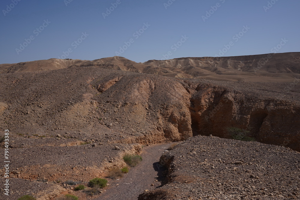 The dried up river bed - the path to the Red Canyon, in the national reserve - the Red Canyon , near Eilat, in southern Israel The dried up river bed - the path to the Red Canyon, in the national reserve - the Red Canyon , near Eilat, in southern Israel