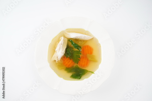 Chicken soup, chicken broth, with pieces of chicken and vegetables. Chicken bouillon, boiled meat