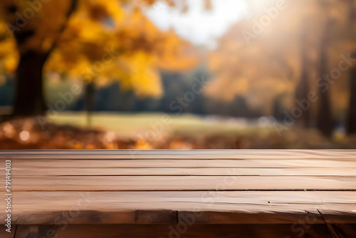 empty natural wooden table for display or product showcase with blurry autumn background scene