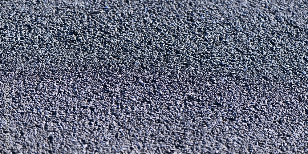 Road surface concepts: close-up photo of bituminous asphalt on a newly paved road Road surface concepts: close-up photo of bituminous asphalt on a newly paved road