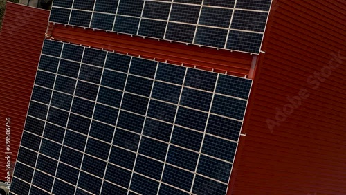 Aerial view of solar panels on a building roof. Fotovoltaic panels installation on factory rooftop photo