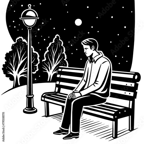 Es de noche un hombre sentado en una banca solitaria sin nadie más al rededor photo