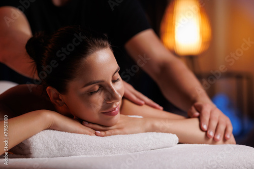 Close-up hands of professional masseuse working, massaging woman's hand in spa salon, therapeutic massage for relaxation. Healing, beauty, health, lifestyle, peace, relief, professional skills.