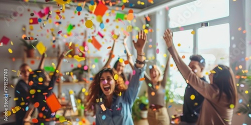 Group of friends celebrating with confetti, expressing happiness and excitement indoors.