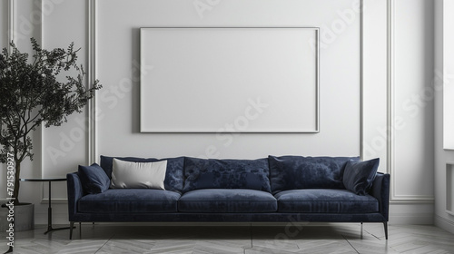 A touch of sophistication defines this minimalist living room, showcasing a sleek navy blue sofa and a pristine white empty frame hanging on the wall. photo