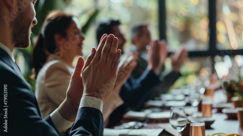 a group of professionals applauding after a successful product launch event in a sleek event space photo