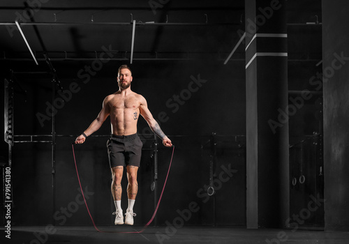 Man jumping rope, doing double-unders as part of crossfit workout. Routine workout for physical and mental health.