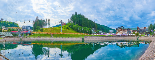 Panorama of Trout Pond, cable car and mountains of Bukovel, Ukraine