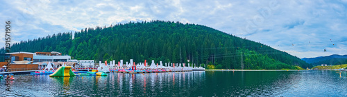 Panorama of the Molodist Lake with aqua park, Bukovel, Carpathians, Ukraine photo