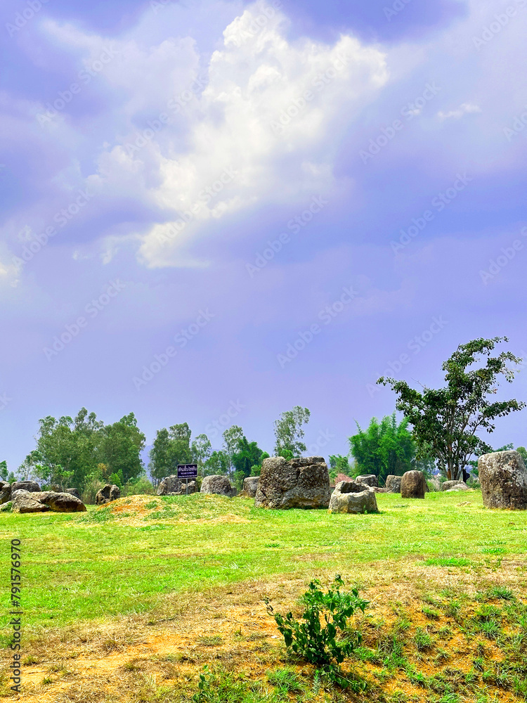 Fototapeta premium The Plain of Jars is considered the most distinctive and enigmatic of all Laos attractions. The large area around Phonsavan, the main city of Xieng Khouang Province is dotted with stone jars.