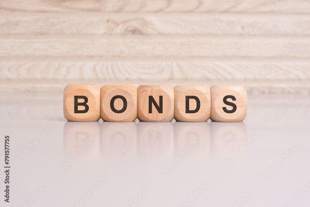 wooden cubes with letters form the expression BONDS. finance and business concept wooden cubes with letters form the expression BONDS. finance and business concept
