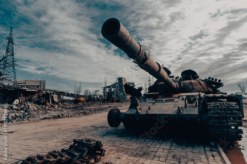 damaged military tank on a city street in Ukraine photo