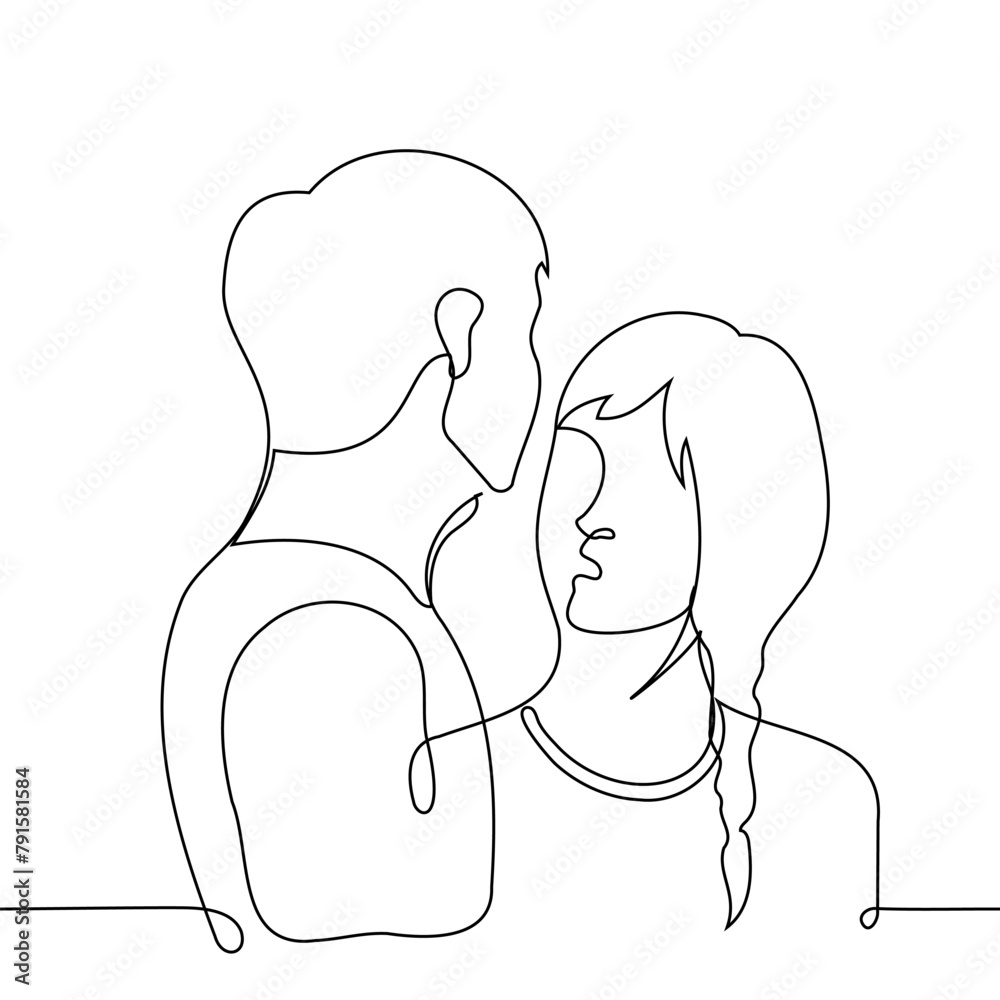 woman looks hypnotized into the face of a man who is taller than her