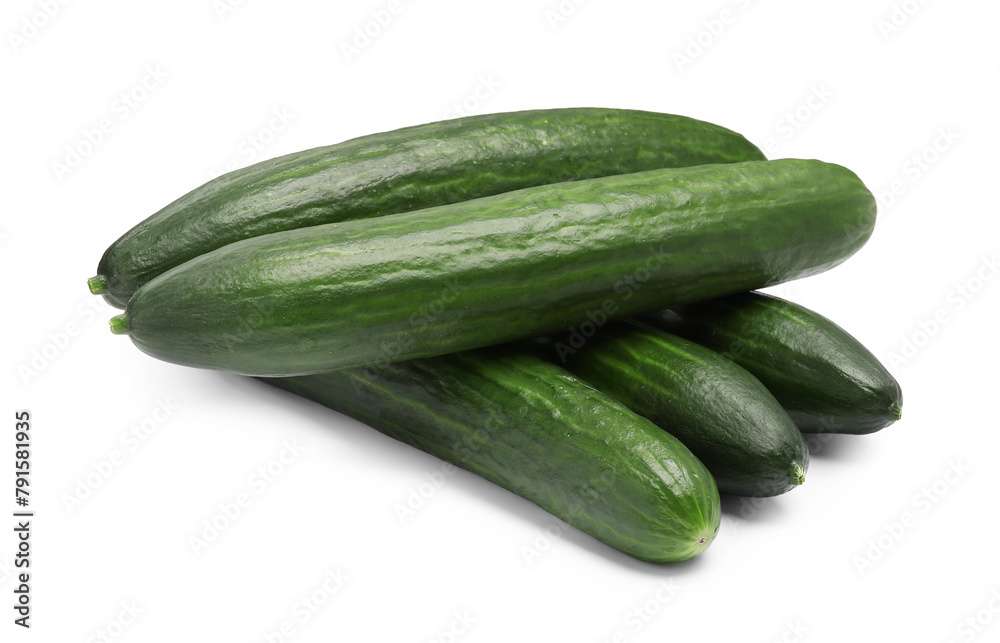 Many long fresh cucumbers isolated on white Many long fresh cucumbers isolated on white