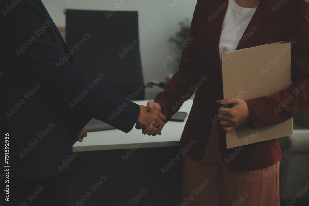Fototapeta premium Business handshake for teamwork of business merger and acquisition,successful negotiate,hand shake,two businessman shake hand with partner to celebration partnership and business deal concept