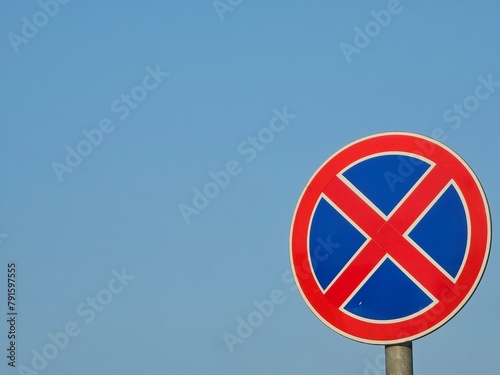 no parking sign on blue sky