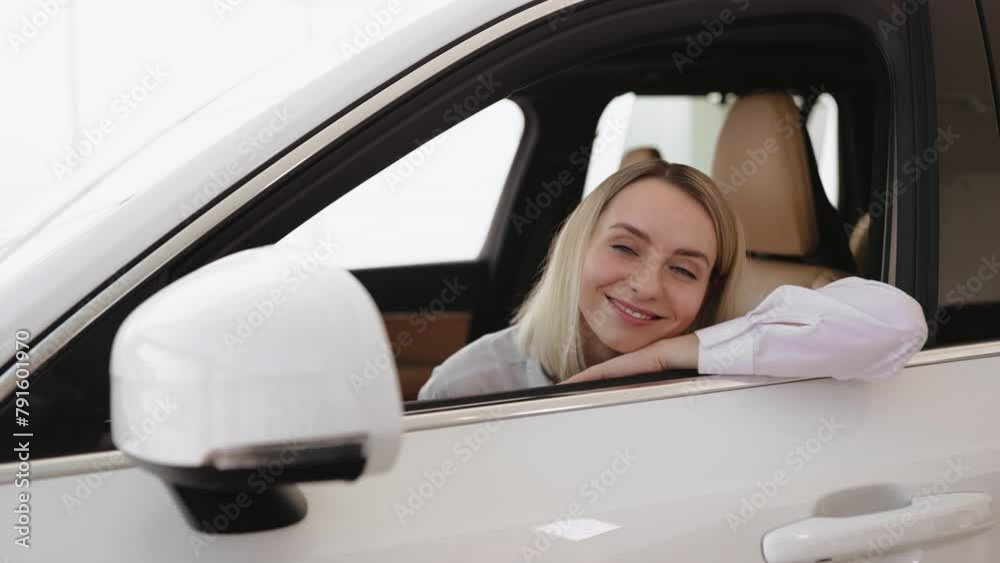 Calm woman, driver, customer, buyer, client in shirt putting hands on opened window, choose auto want buy new automobile in car showroom vehicle salon dealership store motor show indoor. Sales concept Calm woman, driver, customer, buyer, client in shirt putting hands on opened window, choose auto want buy new automobile in car showroom vehicle salon dealership store motor show indoor. Sales concept