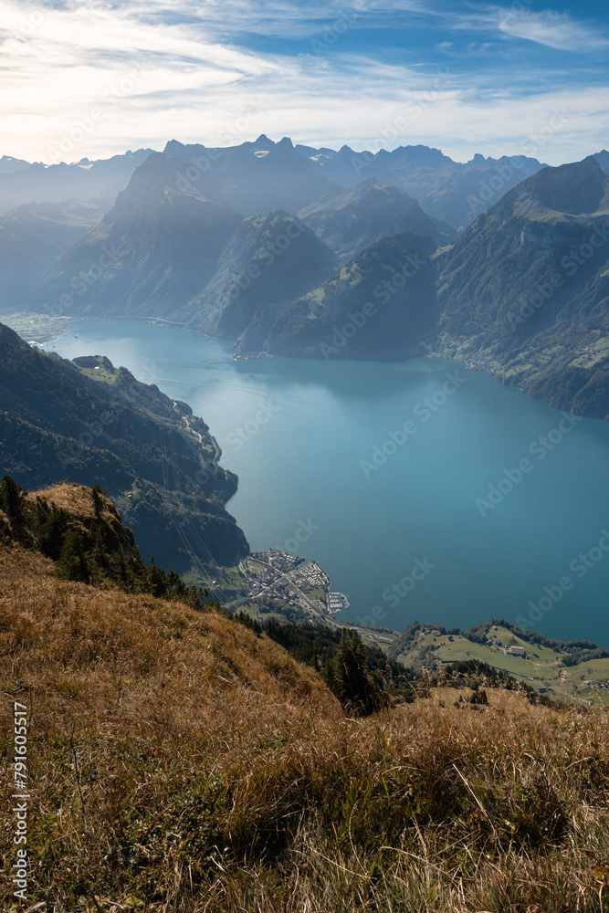 Lake in a valley seen from Fronalpstock summit in Switzerland. Swiss Alps iconic view