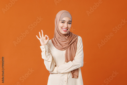 beautiful young smiling muslim woman in traditional religious hijab