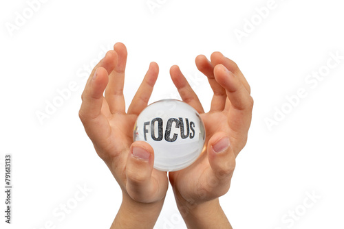 Child hands holding a glass sphere isolated on white background, with focus word distorted, attention  concept